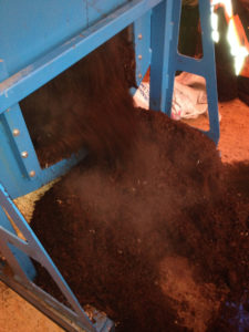 Composting septic sludge with a rotating drum composter.